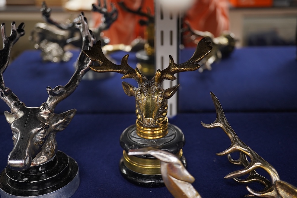 Five chrome and brass car radiator mascots; three in the form of stags’ heads, a stag standing on an oak branch and an Art Deco leading gazelle. Condition - fair, some losses to chrome plating.
